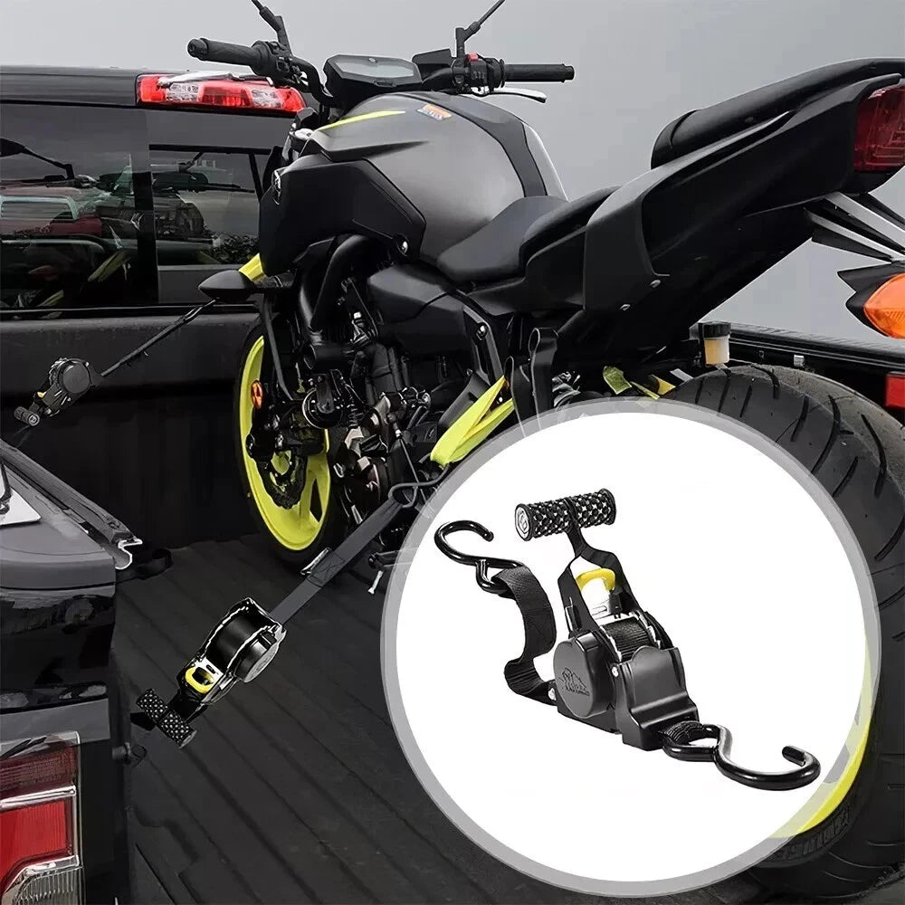 Motorcycle being loaded onto a vehicle with a close-up of a motorcycle strap in the foreground.